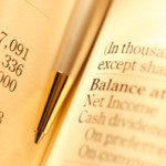 balance sheet and pen